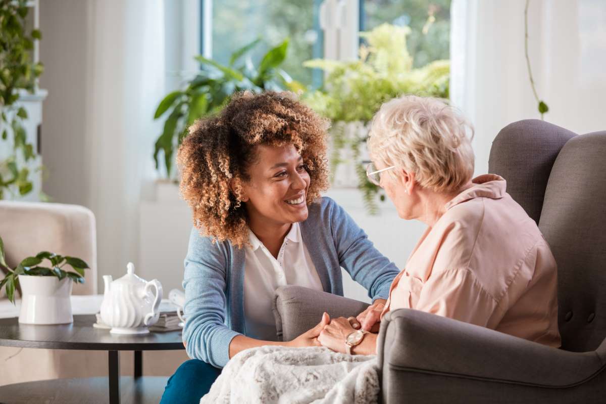 A J.PEER Health carer assisting an older adult with their morning routine at home in Melbourne